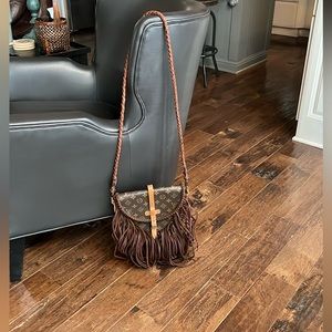 Louis Vuitton repurposed from the online company, Vintage BOHO bags.